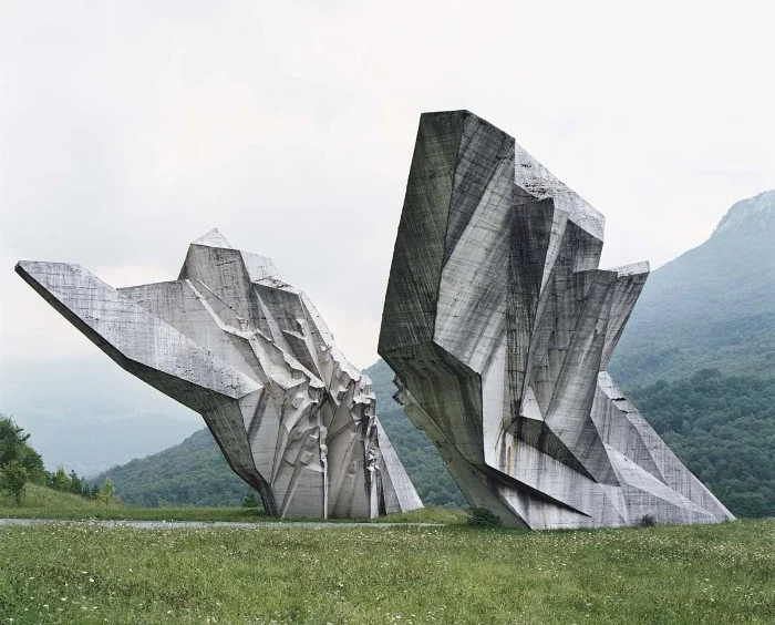world war II brutalist monument, on the territory of former yugoslavia, concrete architecture statue, shaped like jagged shards