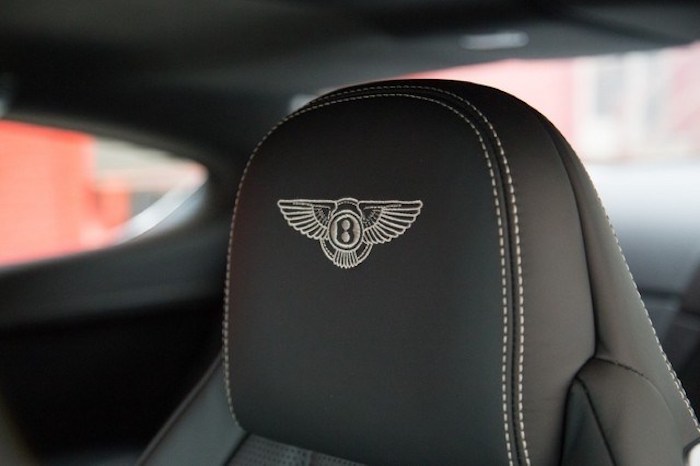 bentley car with an embroidered bentley logo on the driver´s seat