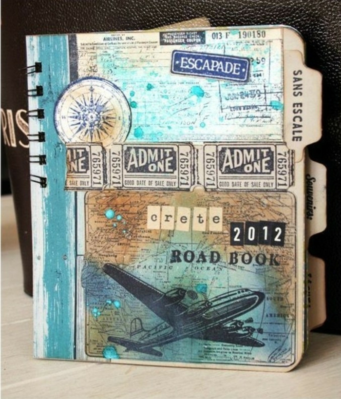 adventure journal, journal with vintage decoration, old tickets, map, airplane cutout, blue and yellow paint, compass