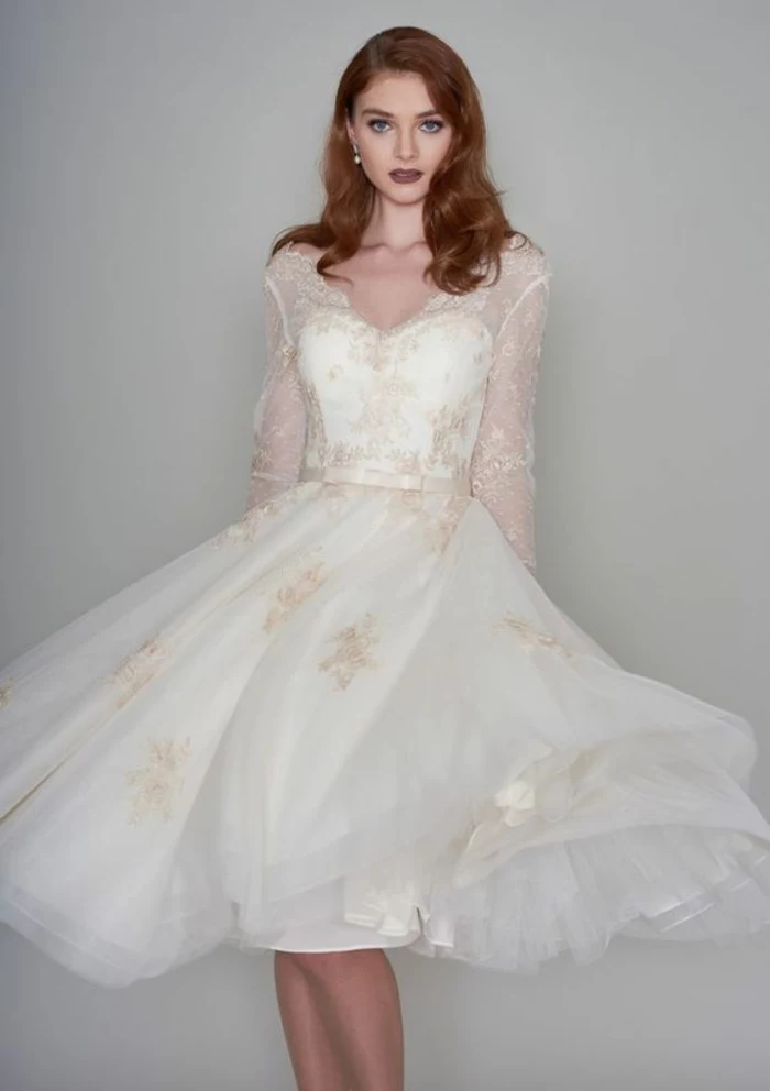 tea length wedding dresses, auburn-haired young bride with knee-length white dress, with cream embroidery and sheer sleeves