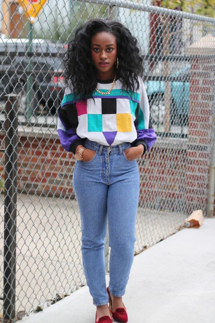 80's hip hop fashion, young black girl with mid length curly hair, wearing jumper with colorful geometric patterns, gold chain and rolex watch, light blue jeans and red loafers