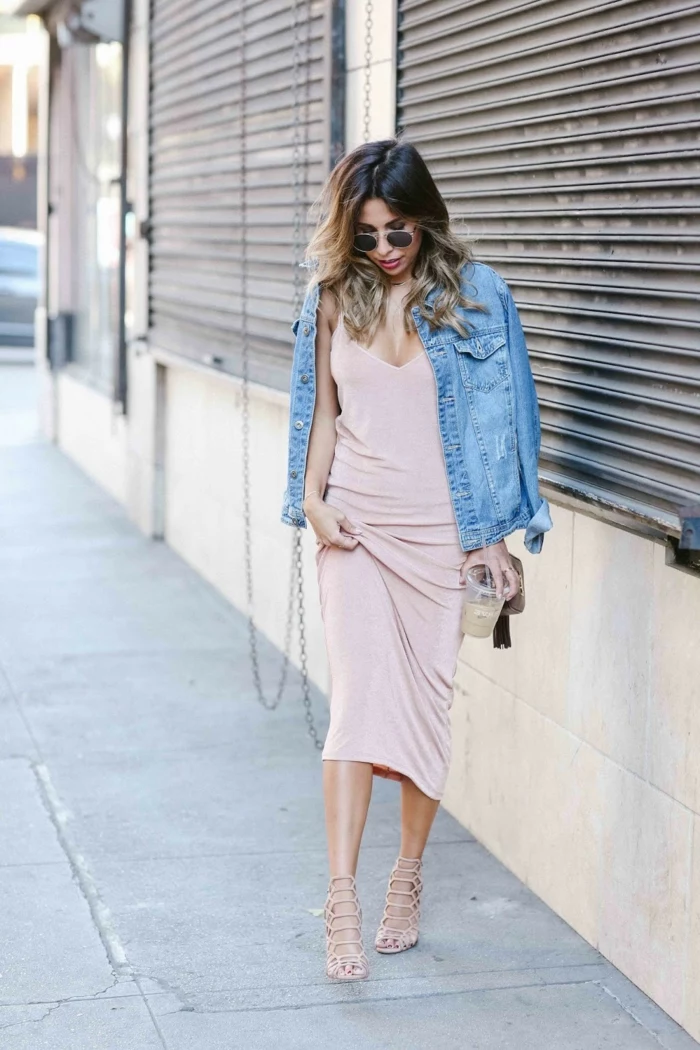 business attire for women, woman with brown and blond ombre hair, long pale pink dress and denim jacket