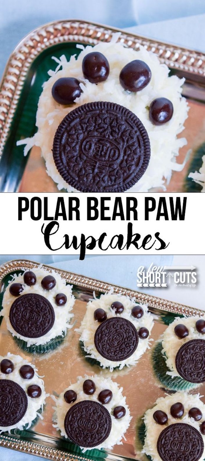 close up of cupcake decorated like paw, with coconut shavings oreo cookie and chocolate candies, six similar cupcakes on silver tray