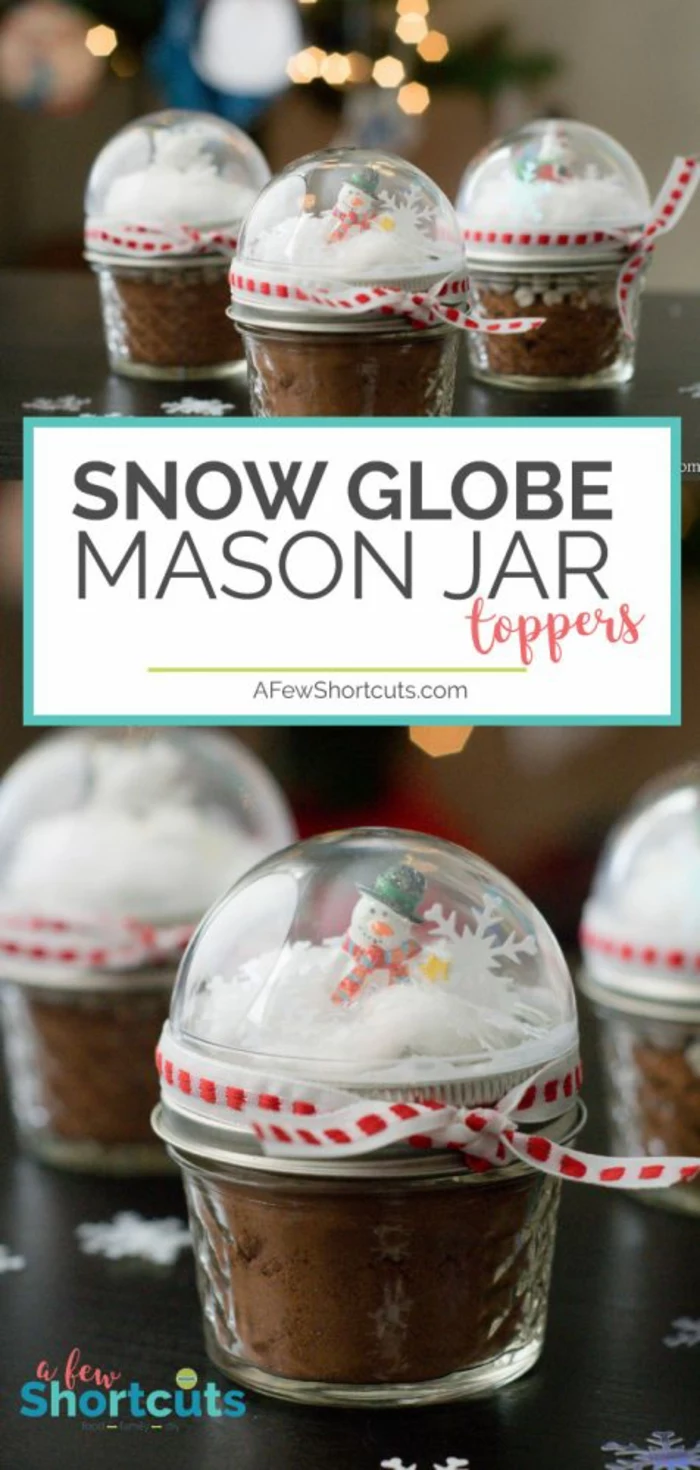 diy christmas gifts, small mason jars filled with cocoa powder, with snow globe toppers, containing fake snow figurines and confetti, red and white ribbons