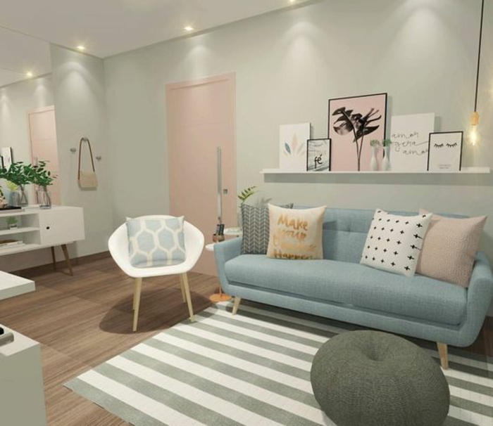 neutral colors, pale pastel duck's egg walls, large mirror and white ceiling, pastel pink door pillow and painting, white chair and white and grey striped rug, pastel blue sofa with four pillows