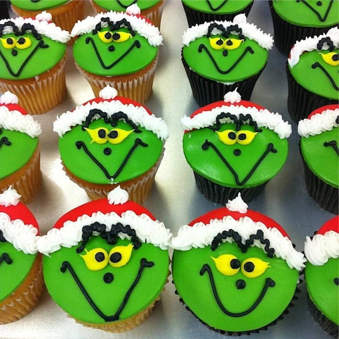 holiday cupcakes, a batch of chocolate and vanilla cupcakes, with green and red fondant icing, decorated with yellow black and white frosting