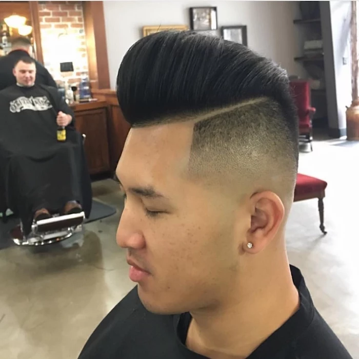 slicked back undercut, Asian man with closed eyes facing sideways, very short side hair and long top hair in pompadour style, brushed back with gel