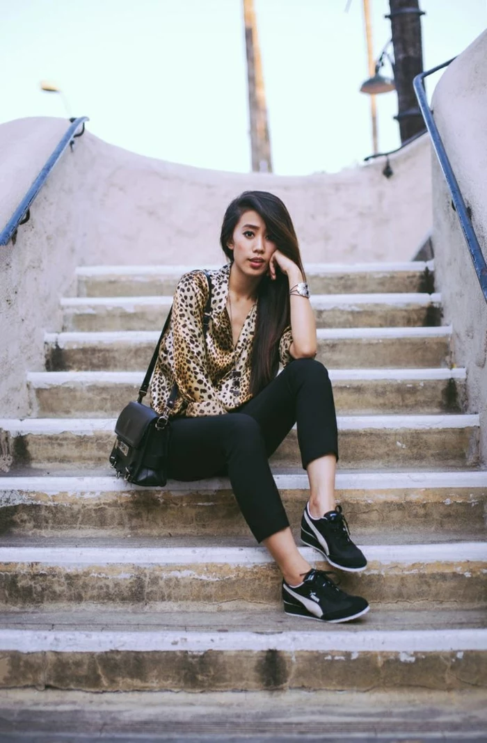 business casual for women, asian woman with long dark hair, animal print shirt and black skinny ankle trousers