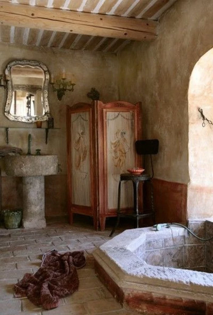 bathroom ideas photo gallery, rustic vintage bathroom, stone sink and ornate mirror, inbuilt stone bath, stone tile flooring