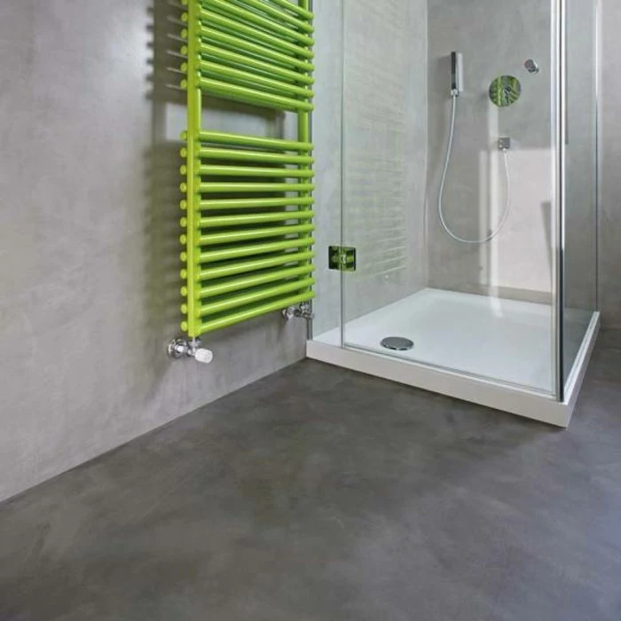 bathroom remodel ideas, room with grey walls and floor, glass shower cabin, and green towel rail