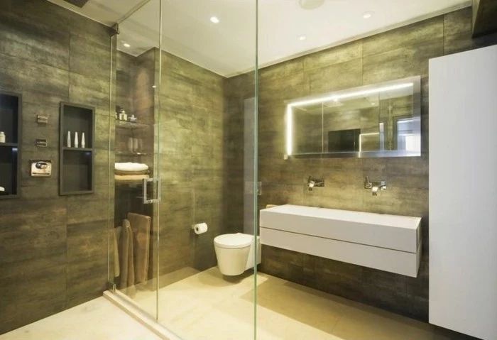 bathroom remodel ideas, khaki colored wall tiles and white floor, large white sink, glass divider with door