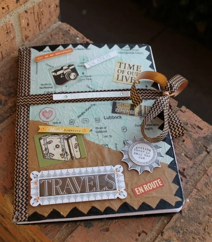 what to get your best friend for her birthday, hand-decorated travel journal, with differently textured and colored paper, cutouts and stickers, tied with a ribbon