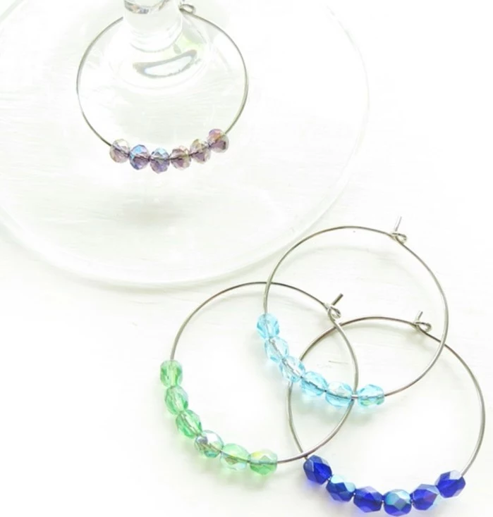 best friend birthday gifts, four bracelets made from wire, decorated with green, pale blue and dark blue, pink sheer stone beads