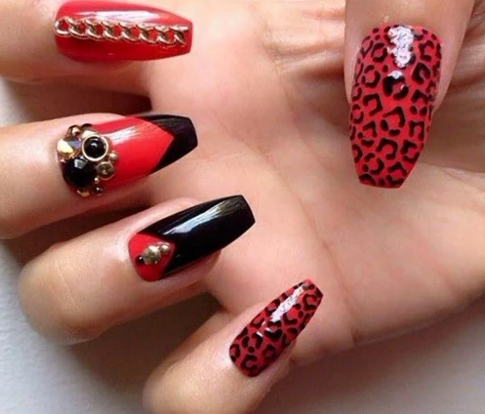 bling nail designs, long square nails, painted in red polish, decorated with black shapes, leopard print rhinestones and gold details