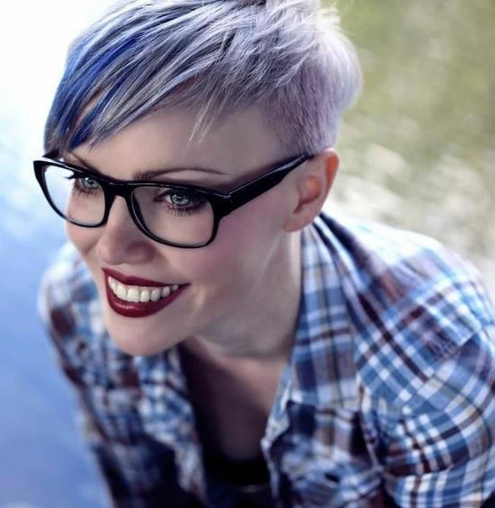 cute short haircuts, smiling woman with deep red lipstick, and glasses with black frames, with short side-parted pixie cut, dyed in pale violet and blue