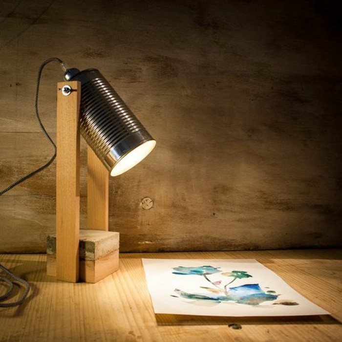 projector-like desk lamp, lamp made from wood and a tin can, shedding light on a watercolor drawing