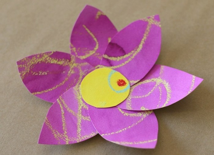 craft ideas for kids, large flower made of purple and yellow paper, decorated with yellow, blue and red scribbles