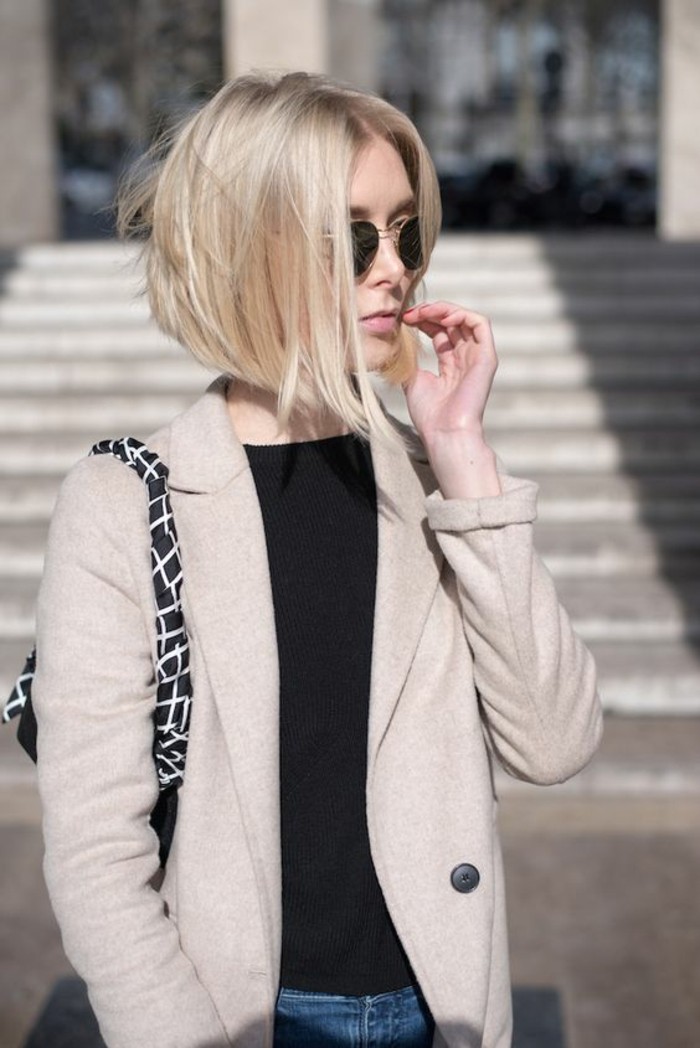 hairstyles for short hair, woman with short blonde bob, and black round sunglasses, wearing black top and light cream blazer