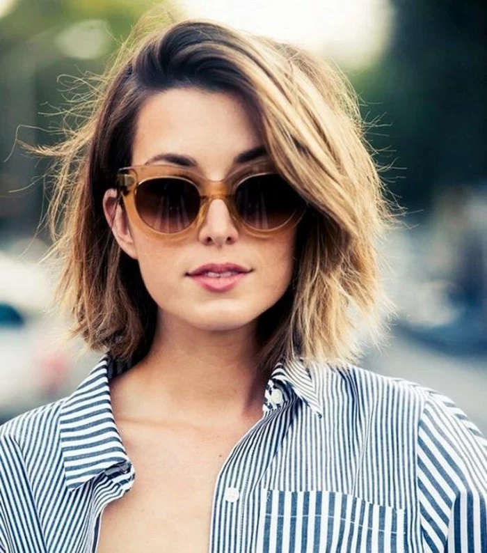 hairstyles for short hair, young woman with dirty blonde hair, wearing sunglasses with big plastic frames, and a blue and white striped shirt