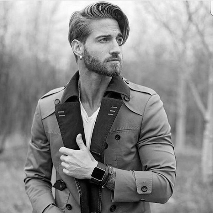 medium length hair, man with trench coat, short beard with mustache and earring, side-swept pompadour bangs