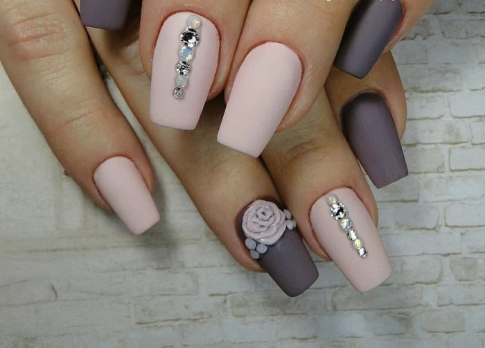 rhinestone nail art, pale pastel pink and dark pastel purple matte nails, decorated with acrylic rose and white and silver rhinestones