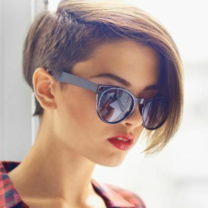 cute hairstyles, young woman with hair cut short on one side, and kept long on the other, wearing sunglasses and bright red lipstick