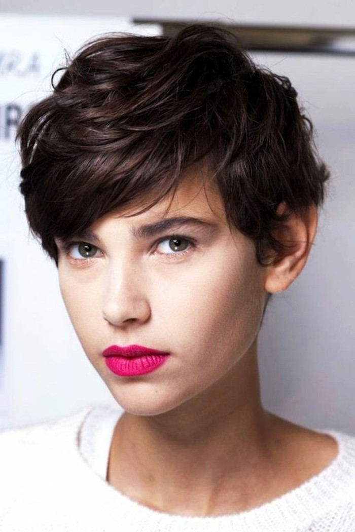 short hair cuts, young woman with short masculine layered hairstyle, side bangs and bright pink lipstick