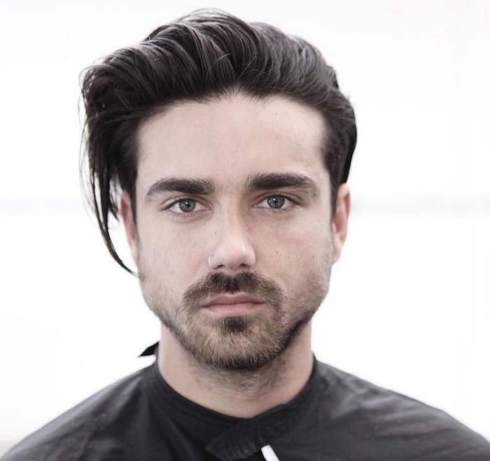 medium length hairstyles, dark-haired man with slicked back bangs, short beard and mustache