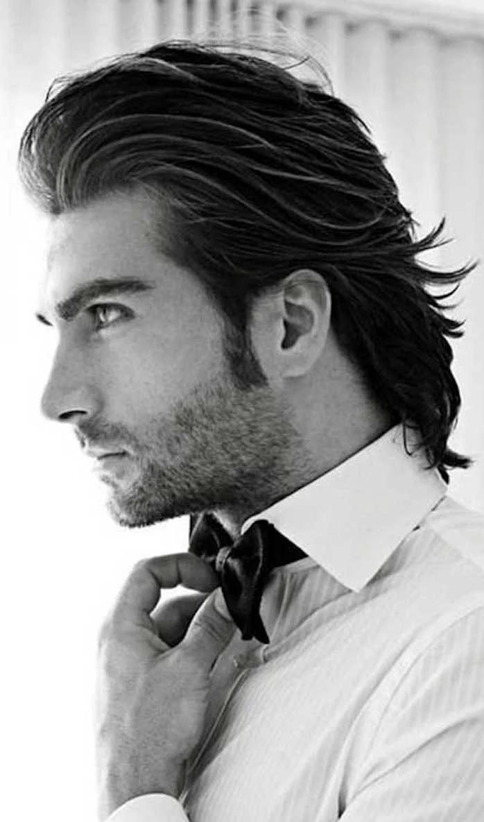 shoulder length hairstyles, man with white shirt and bowtie, black hair slicked backwards