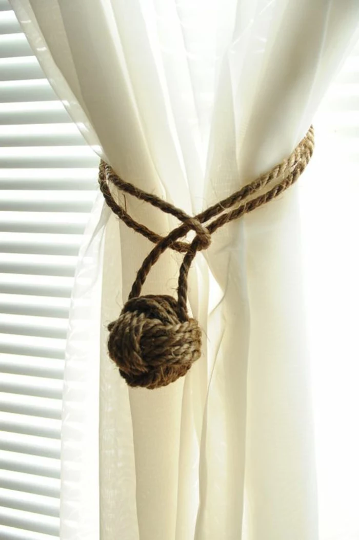 summer diys, semi-sheer cream white curtain, decorated with burlap rope, tied with a ball-shaped sailor's knot
