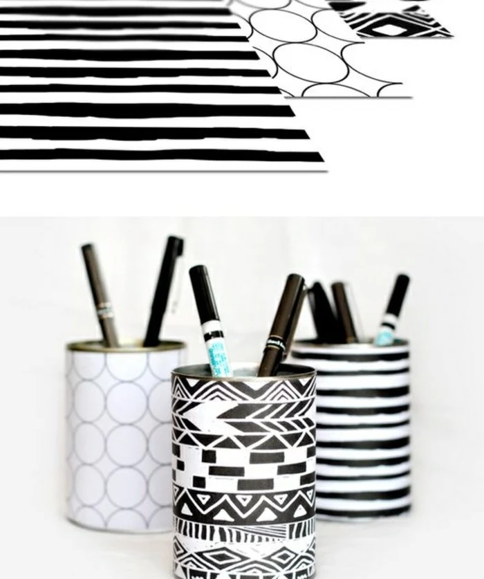 tin can projects, three sheets of black and white patterned paper, wrapped around three tin cans, containing different pens