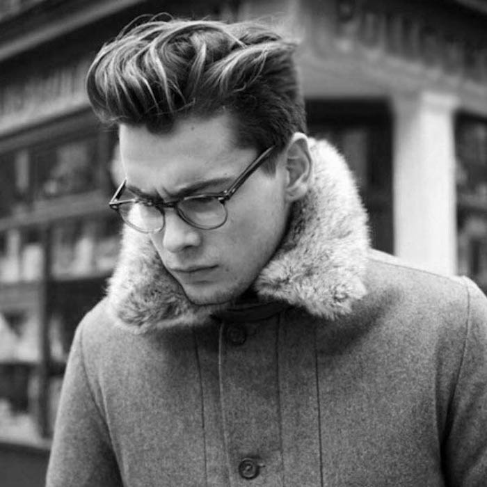 hairstyles for shoulder length hair, young man with glasses, messy hair gelled up in pompadour style, disconnected undercut nd winter coat