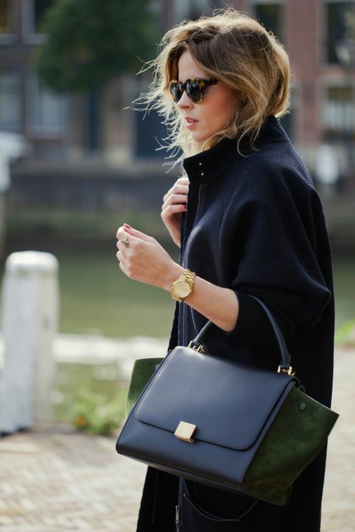 casual business attire, black woolen coat, worn by blonde woman with sunglasses, holding black leather bag, with dark green suede details