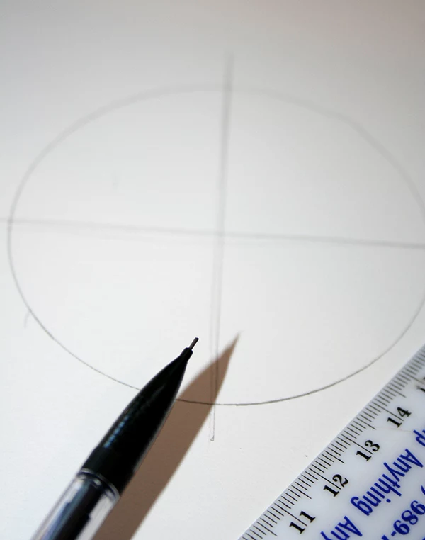 circle with two crossed lines, drawn in pencil on a white piece of paper, craft ideas, plastic ruler and mechanical pencil