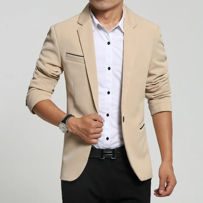 cream blazer with rolled sleeves, over white shrirt with black buttons, business casual attire, worn with black trousers and belt
