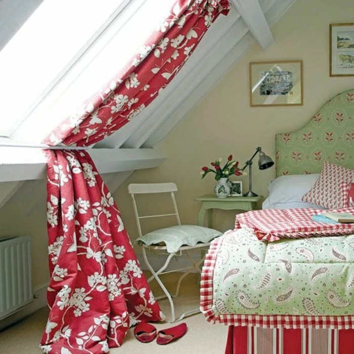 window treatment ideas, attic bedroom with white wooden beams, and gable windows, red and white floral curtains, pale green and red furniture and textiles