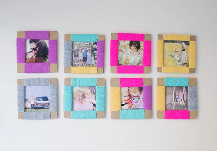 square photos in carboard frames, decorated with differently colored thread, a total of eight, mounted on white wall