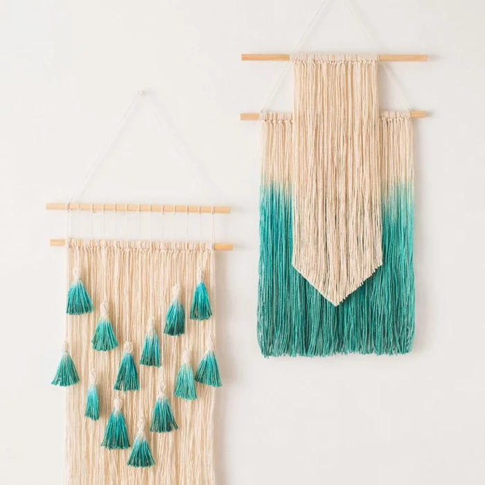 macrame wall decorations, diy craft projects, made from cream and blue, dip-dyed thread, hanging on white wall, from wooden poles