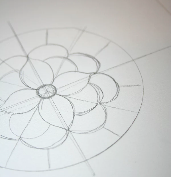 flower with many pettals, drawn in pencil, in the middle of a circle, with several crossing lines, craft ideas