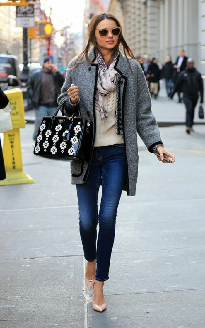 large grey woolen coat, over white top, and patterned scarf, worn by miranda kerr, with business casual jeans