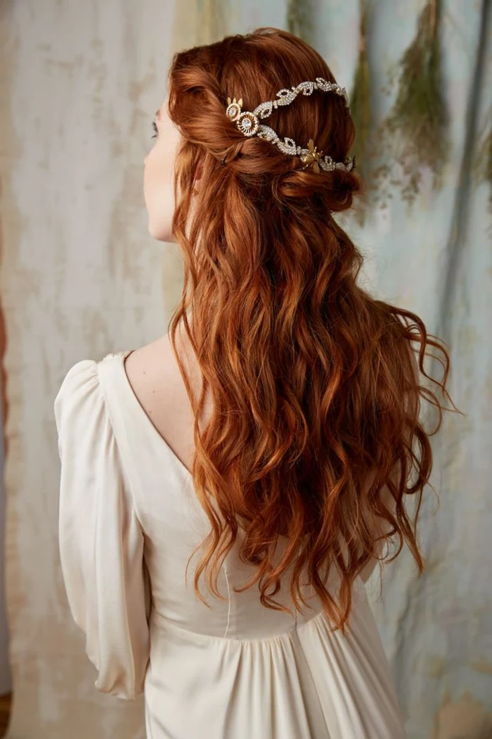 medieval times hair, wavy ginger hair, twisted like a crown at the top, decorated with a pearl and gold ornament, worn by woman in white, long-sleeved dress