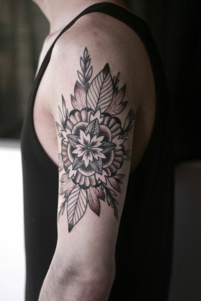 shoulder flower tattoos, man in black tank top, with floral mandala tattoo, with petals and leaves, outlined with black ink, and shaded with brown