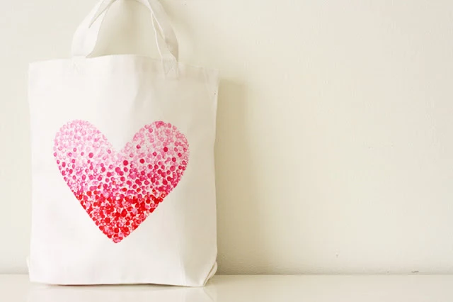 white fabric tote bag, decorated with large heart-shape print, made from little pink, and red stamped dots