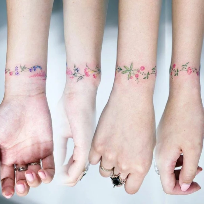 wildflower tattoo, a wrist bracelet-type tattoo, seen from all angles, with many tiny, intertwining flowers and leaves, in pink and purple, blue green and red