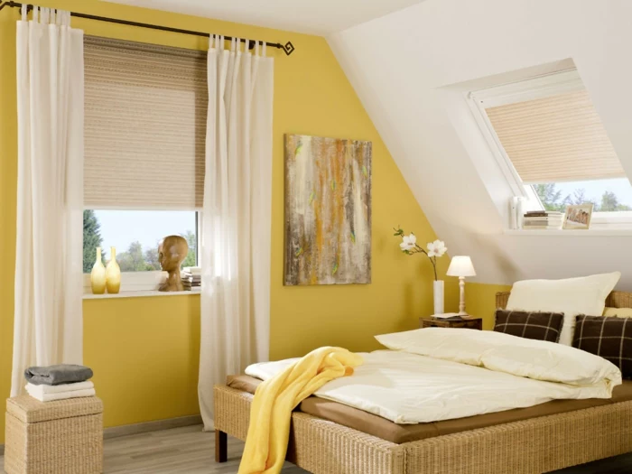 bedroom curtains, bedroom with yellow and white walls, bed in warm colors, and windows with pale cream blinds and curtains