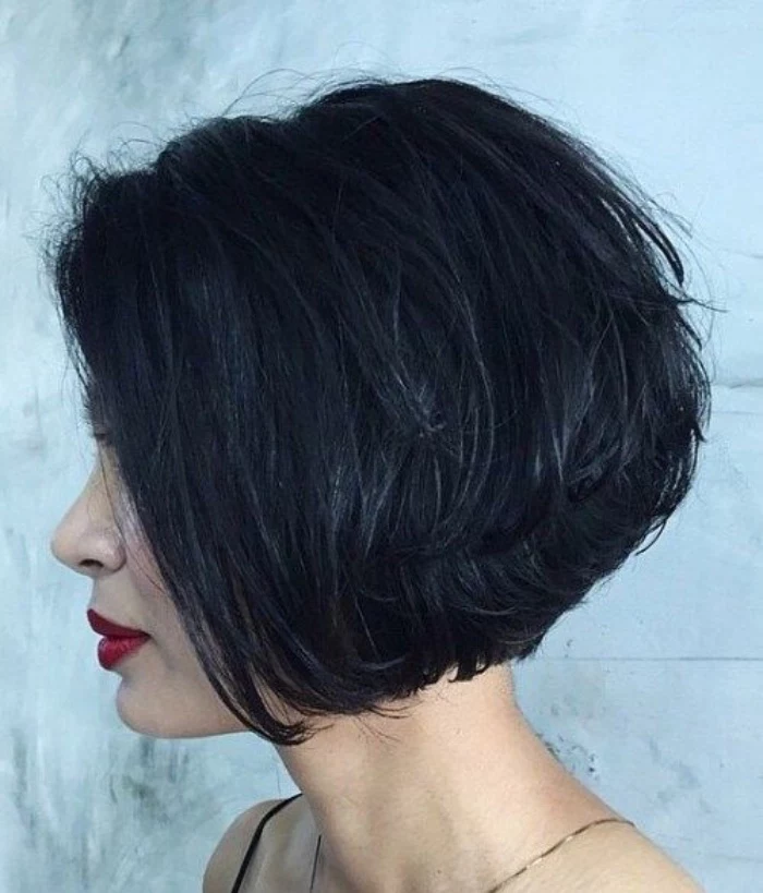 black layered hair, worn by woman with dark red lipstick, short bob hairstyles