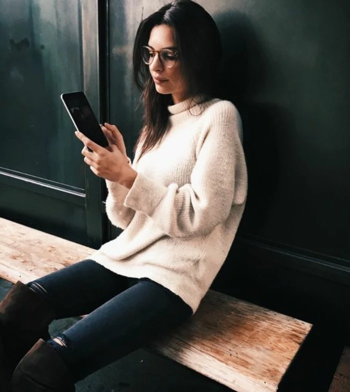 business casual women, brunette woman with glasses, wearing soft pale cream chunky knit turtleneck sweater, over dark torn jeans, and brown suede over-the-knee-boots