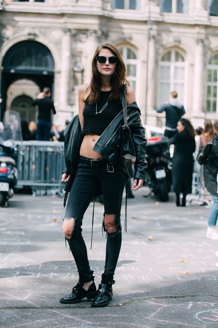 women outfits, slim brunette woman, wearing black cropped tank-top, dark, torn jeans, black patent leather brogues, and leather biker jacket