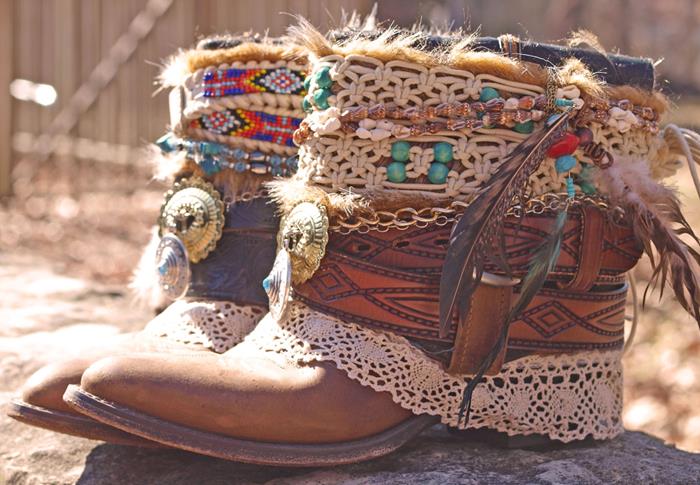 ankle boots in bohemian fashion, decorated with crochet lace ribbons, brown leather straps, gold chain and beads, feather and macrame details