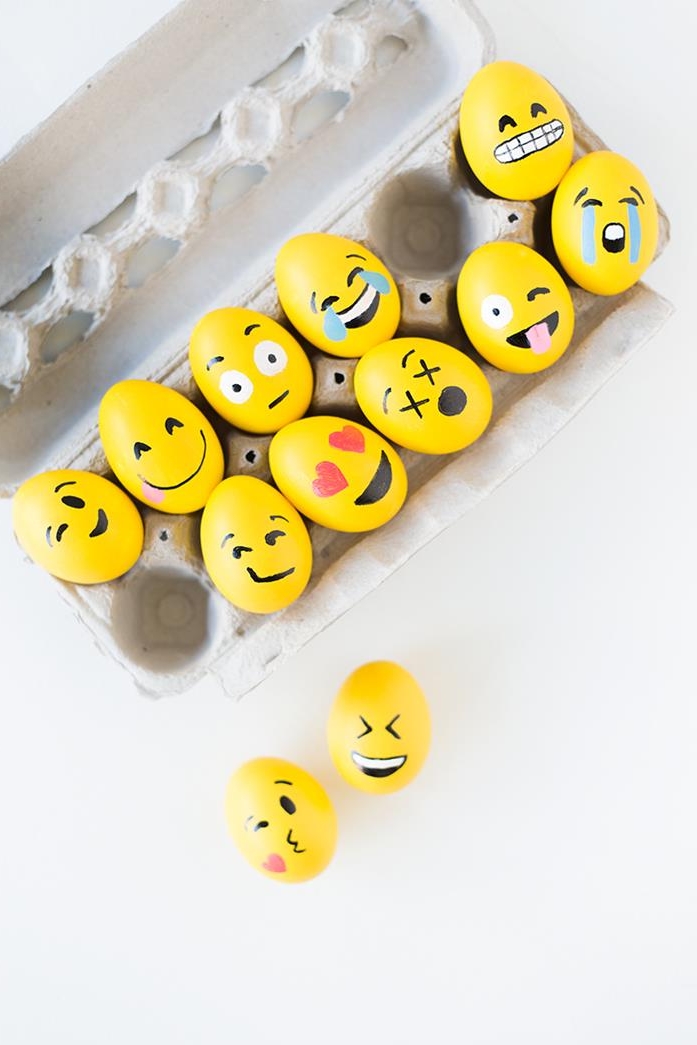 emoji easter eggs, dyed in yellow, faces hand-painted with black, red white and blue marker